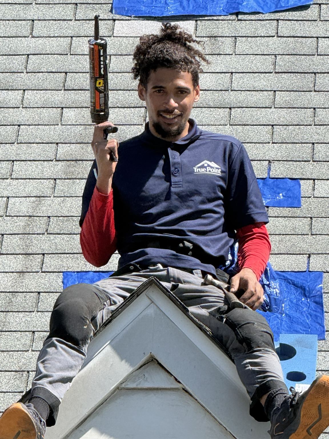TruePoint team member on roof